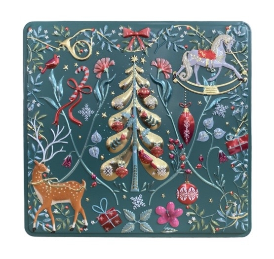 Grön plåtburk med präglat julmotiv