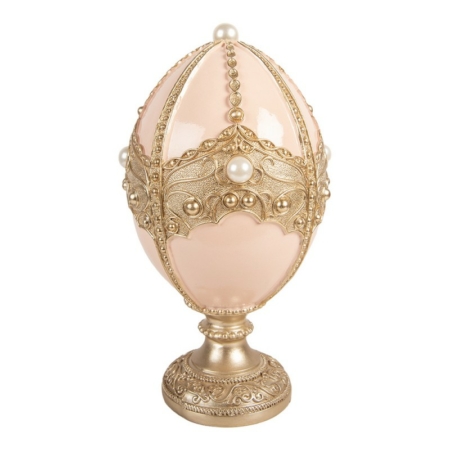 Rosa ägg på fot med gulddetaljer